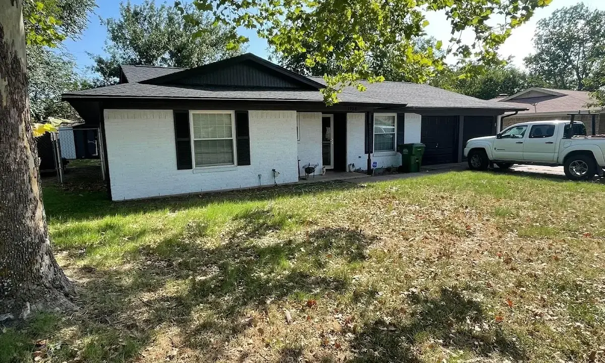 Professional roofing crew working on a residential roof in Midland